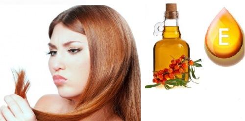 секущиеся волосы у девушки на фоне витамина E и ягод облепихи
